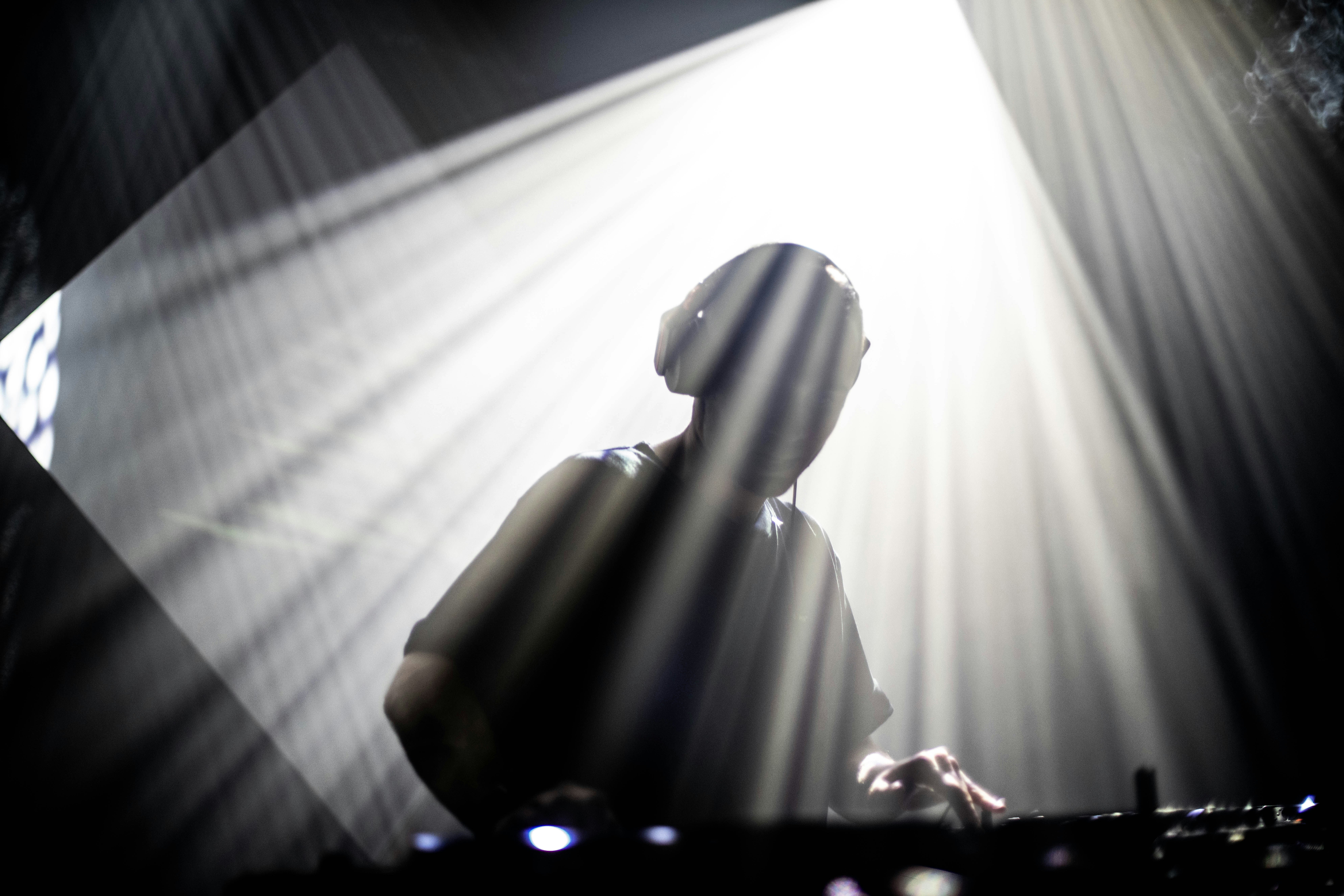 A DJ spinning decks at Beast House's White Out New Year's Eve party.